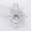 Three vintage crystal spider brooches, silver, gold and black alloy pins, Muslim-style white display stand details Picture